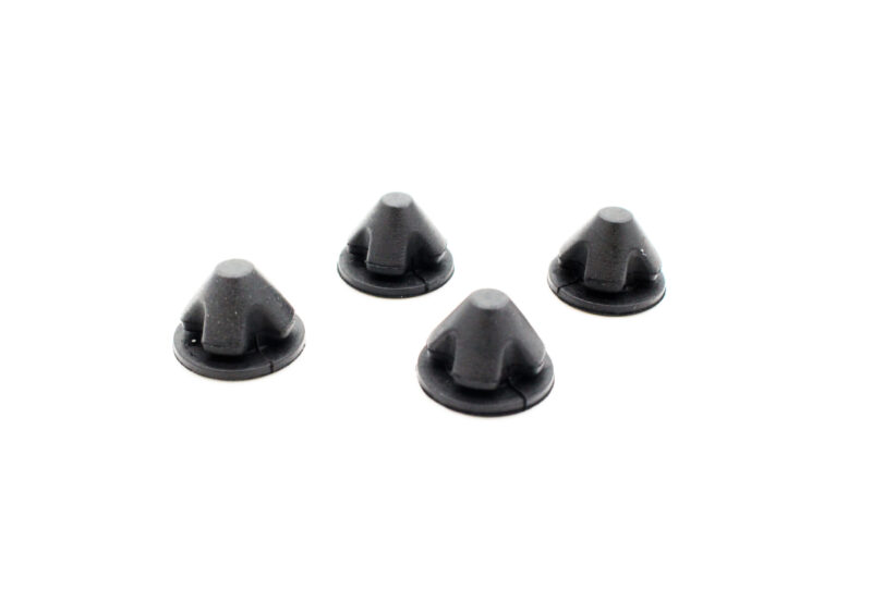 25-tfsi-engine-cover-grommets_53352784833_o-scaled-1jpg - OPSHOLDERS Close-up of several small black plastic conical knobs with circular bases on a white background.