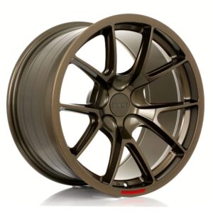Bronze 5‑spoke alloy car wheel with a centered cap bearing the brand logo (Forge).
