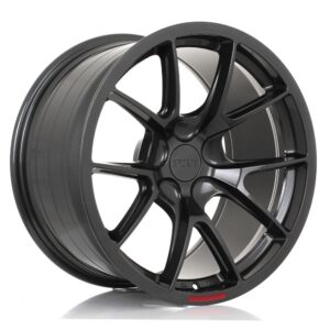 Black multi‑spoke alloy car wheel shown at an angle for a product image.