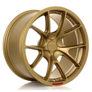 Gold alloy car wheel rim with a five-spoke design and center cap on a white background