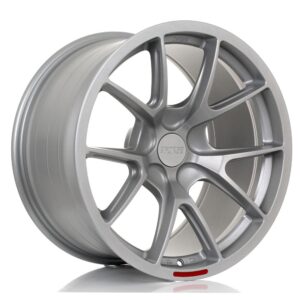 Silver alloy car wheel rim with a multi-spoke design and center cap