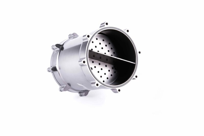 Metal washing machine drum viewed from the side, showing a perforated inner cylinder and outer shell in chrome finish.