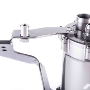 Close-up of a stainless steel espresso machine lever and portafilter fittings.