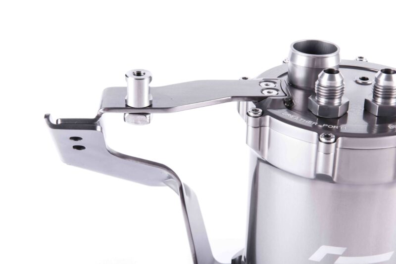 Close-up of a stainless steel espresso machine lever and portafilter fittings.
