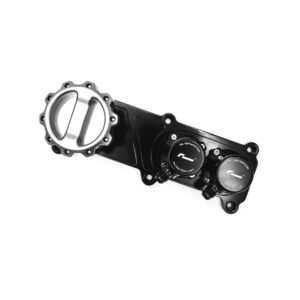 Partial view of a black motorcycle engine component with round oil separator caps and bolts.