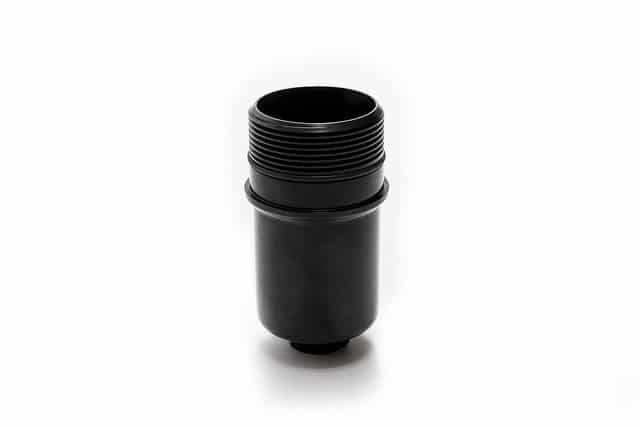 36949566203_ee527754c8_z__709211517223948-1jpg - OPSHOLDERS Black plastic threaded adapter/coupler with ridged exterior, used to connect two components