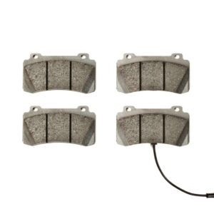 Set of four gray disc brake pads arranged in a 2x2 grid, with one pad connected to a black wear-sensor cable at the bottom-right.