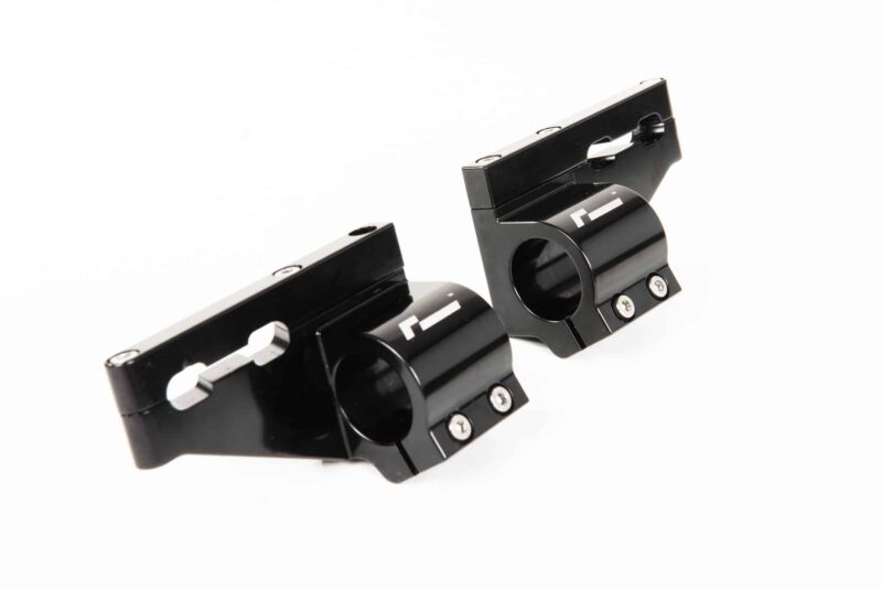 45820467122_083ca6c27a_k-1jpg - OPSHOLDERS Close-up of black metal mounting brackets with circular clamp holes and visible screws.