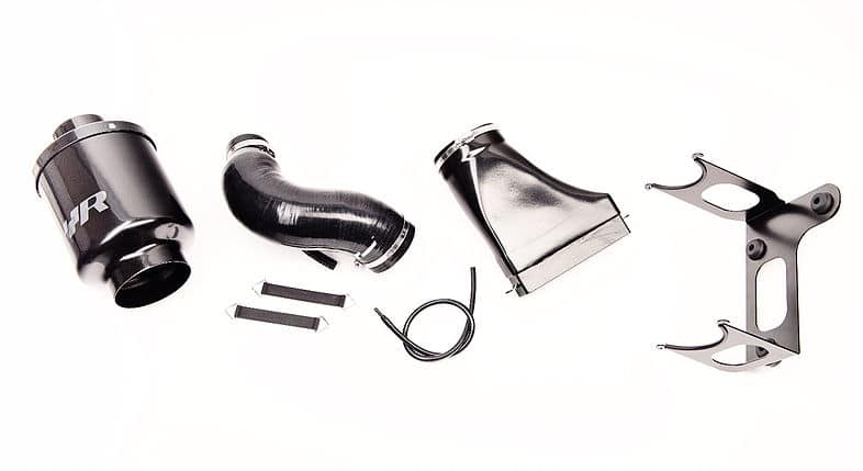 4a9732db32eemv2-1jpg - OPSHOLDERS Automotive turbo kit components laid out on a white background: elbow pipe, black silicone elbow, clamps, brackets, and mounting hardware.
