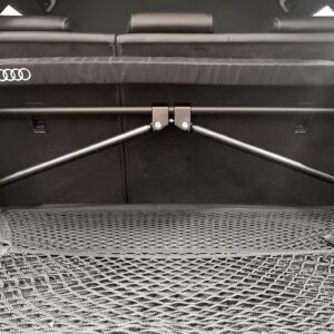 50813847631_db216464c6_k-1jpg - OPSHOLDERS Rear cargo area of an Audi with a wide padded crossbar and carbon-fiber support rods across the opening, seats folded in the back