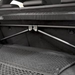 50813847836_b3fda649c0_k-1jpg - OPSHOLDERS Audi-branded cargo area with carbon fiber rails and a textured cargo net in a dark trunk.