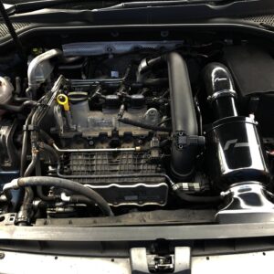 Front view of a car engine bay with hoses, battery, and intake tube visible under the hood across the frame