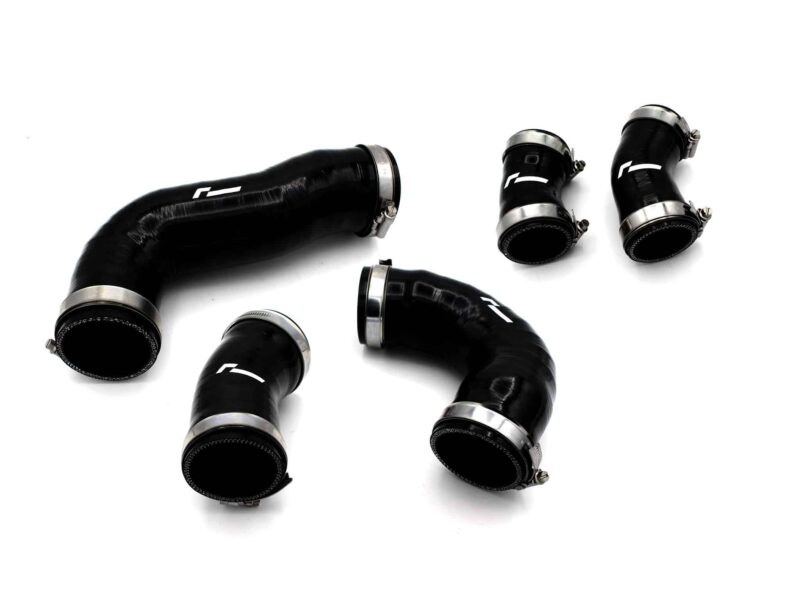 Several black automotive hoses with metal clamps on a white background, laid out in a scattered arrangement.