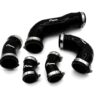 51204872314_1c3bc5921c_k-1jpg - OPSHOLDERS Black silicone automotive hoses with metal clamps scattered on a white surface.
