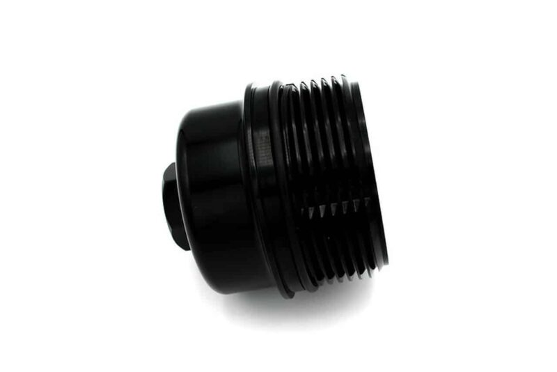 Black knurled threaded adapter/knob seen at an angle, likely a camera or equipment part.