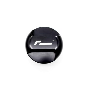 Close-up of a glossy black circular object with a white geometric logo on its surface, cropped at the bottom.