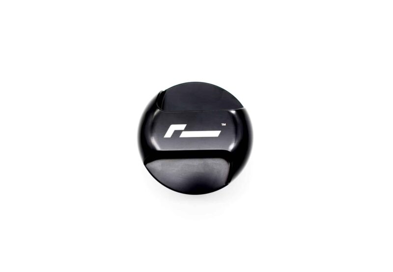 Close-up of a glossy black circular object with a white geometric logo on its surface, cropped at the bottom.