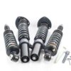 52424668196_4a205a4e07_c-1jpg - OPSHOLDERS Set of adjustable coilover shocks with mounting flanges and small Allen wrenches for installation, laid out on a white surface.