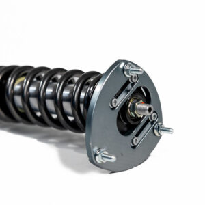 52424669611_c2b496e5e5_c-1jpg - OPSHOLDERS Coilover shock absorber with a helical spring and mounting plate against a white background, car suspension component