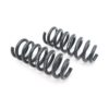 53272536009_8877297ae3_k-1jpg - OPSHOLDERS Pair of dark gray automotive coil springs laid out on a white background, likely suspension components