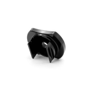 Close-up of a black glossy plastic mechanical part with curved edges and a central hole on a white background.
