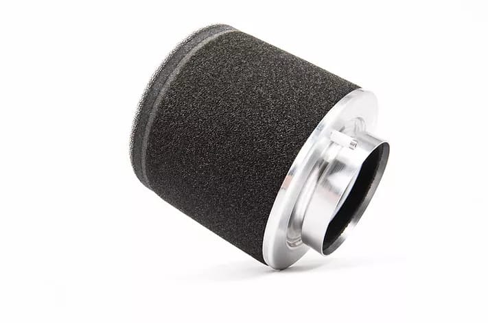 677af8_f899b5adf8014da6a50132ec28a0361c_mv2_d_7360_4912_s_4_2-1jpg - OPSHOLDERS Cylindrical black foam air filter with a silver metal end cap, angled to the side.
