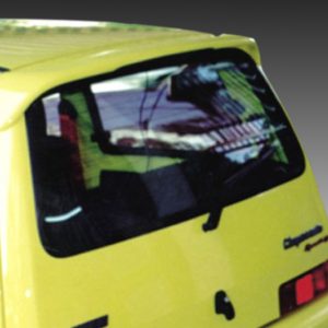 Rear view of a yellow van with a cracked rear window and visible damage from an impact.