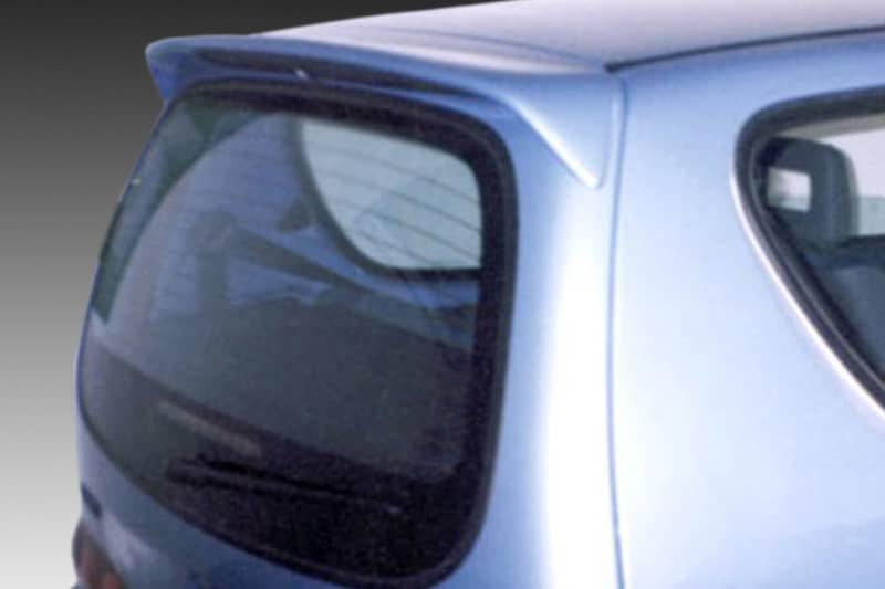 A-145_1jpg - OPSHOLDERS Blue hatchback viewed from the rear corner showing the curved rear window and small spoiler on top of the tailgate