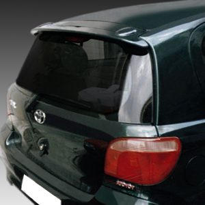Rear view of a dark green hatchback car, showing the trunk, bumper, and red taillight assembly.