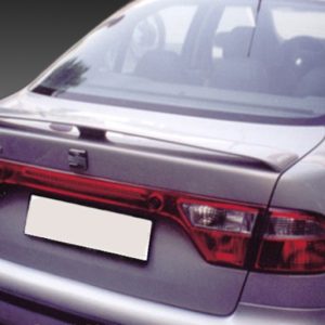 Rear view of a silver sedan with a blurred license plate and red tail lights.