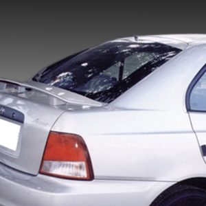 Rear view of a white sedan with a spoiler, taillights visible, and a cracked rear windshield/window fading to black background.