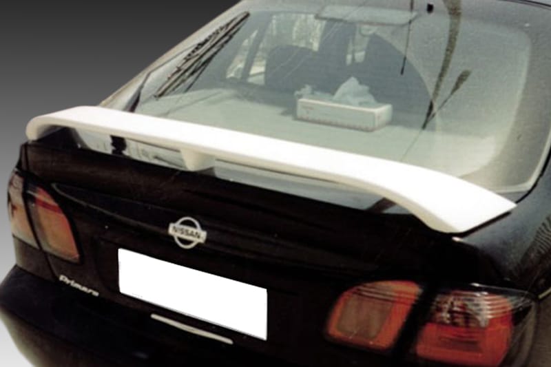A-175_1jpg - OPSHOLDERS Rear view of a black Nissan sedan with a white spoiler mounted on the trunk. The license plate is whiteed out for privacy.