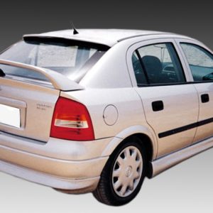 White four-door sedan viewed from the rear-right, featuring a rear spoiler and black door trim.