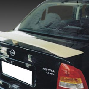 Rear of a black Opel Astra with a beige rear spoiler and red taillights, license plate blurred out.