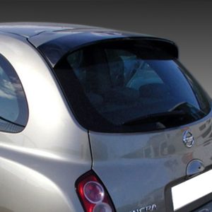 Rear view of a silver Nissan hatchback, showing tail lights and curved rear window against a dark gradient background.