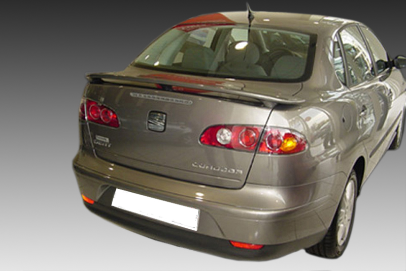 A-265_1jpg - OPSHOLDERS Rear view of a metallic gray SEAT car showing taillights, trunk lid, and spoiler against a gradient background.