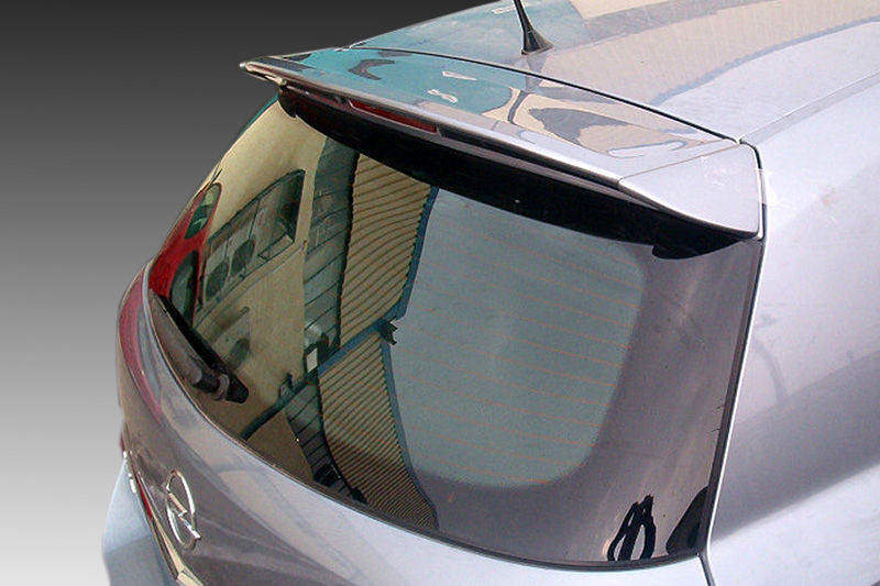 A-273_1jpg - OPSHOLDERS Close-up of the rear of a silver hatchback, showing the curved rear window and spoiler with reflections of a building in the glass.