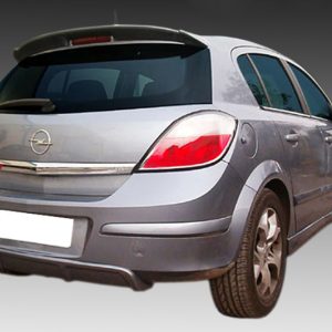 A-273_2jpg - OPSHOLDERS Rear three-quarter view of a silver Opel hatchback against a gray gradient background, showing the taillights and rear bumper.