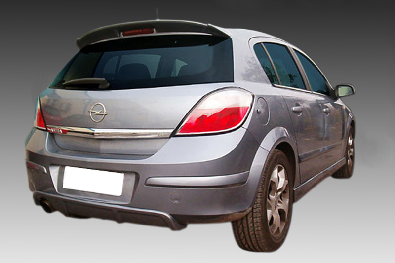 A-273_2jpg - OPSHOLDERS Rear three-quarter view of a silver Opel hatchback against a gray gradient background, showing the taillights and rear bumper.