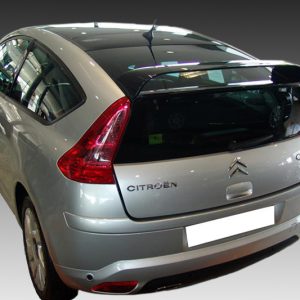 Rear-left view of a silver Citroën C4 hatchback photographed in a studio setting above a gradient background, showing tail lights and rear window.