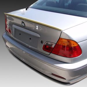 Silver sedan rear view showing taillights, trunk, and BMW emblem with no license plate visible, viewed from an angled left-rear perspective