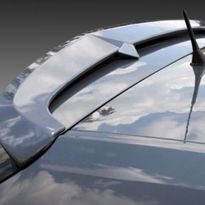 Close-up of a car roof with a rear spoiler and a black antenna, reflecting a cloudy sky on the glossy surface