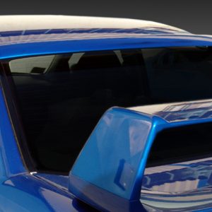 Close-up of a blue sports car rear with a large wing spoiler and tinted rear window.