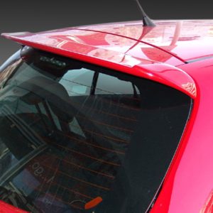 Close-up of a red car's front windshield and roof, with the wiper resting along the bottom edge.