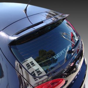 Rear view of a dark blue SEAT hatchback, with reflections of buildings and trees in the rear window.