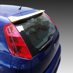 A-298_2jpg - OPSHOLDERS Rear-left three-quarter view of a blue hatchback car with a beige spoiler, taillight, and rear window wiper viewable to the back end.