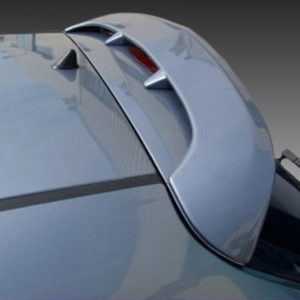 A-314_2jpg - OPSHOLDERS Close-up of a blue car's rear spoiler with fins, showing a glossy finish and curved design.