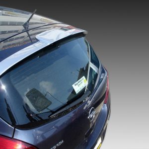 Blue hatchback viewed from above, showing the rear window with a small sticker and a subtle spoiler edge in urban reflections.