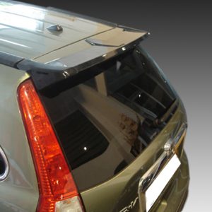 Rear view of a green SUV with a large rear window and vertical taillight cluster on the left edge of the hatchback surface, gradient background behind it.