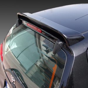 A-321_2jpg - OPSHOLDERS Rear three-quarters view of a dark blue hatchback with a roof spoiler and rear window wiper on the tailgate surface, viewed from above